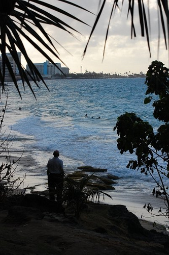 Photograph of man looking out at ocean by Jennifer Kaplan